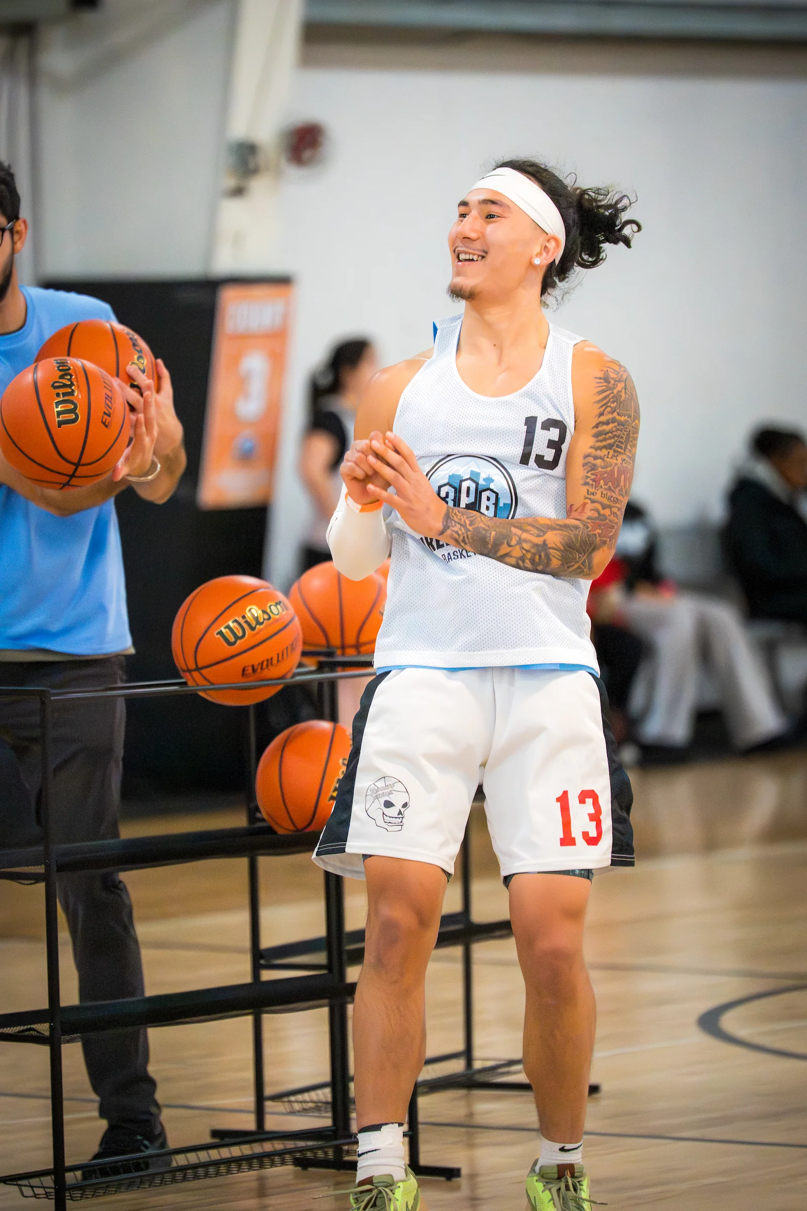 Player smiling while shooting in the 3PT contest at 3PB tournament